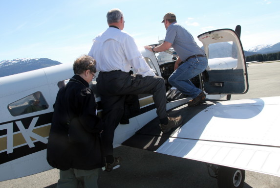 Mom and Dad and the pilot board the Piper Cherokee Six